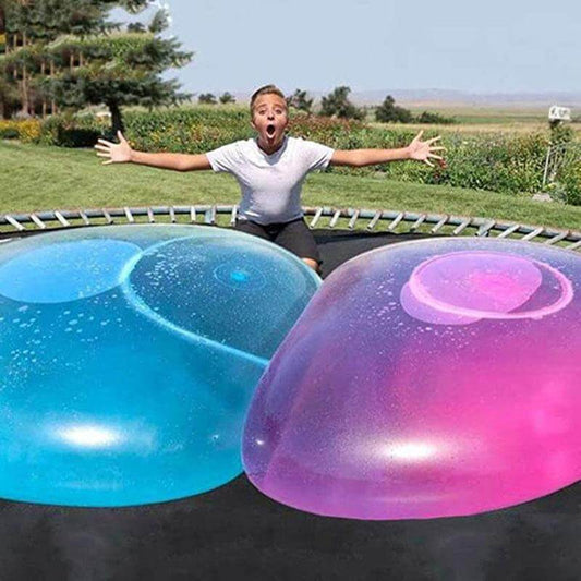 Kids playing with a giant inflatable bubble ball toy outdoors, perfect for summer fun.