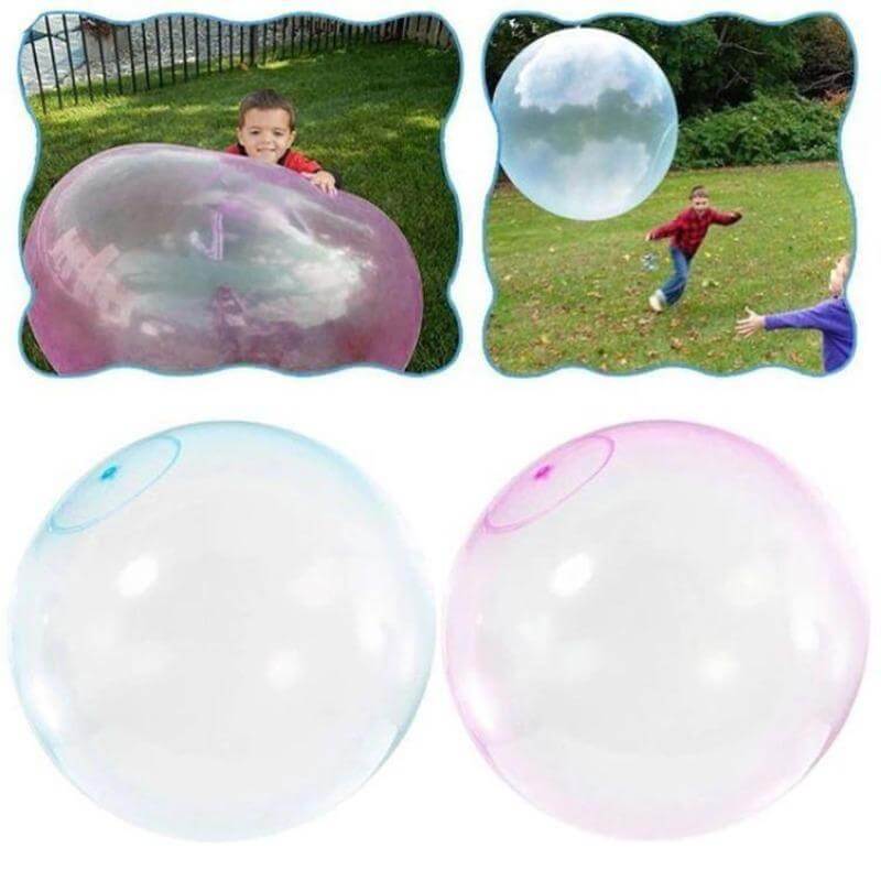 A group of children joyfully interacting with a large inflatable bubble ball toy in a park setting.