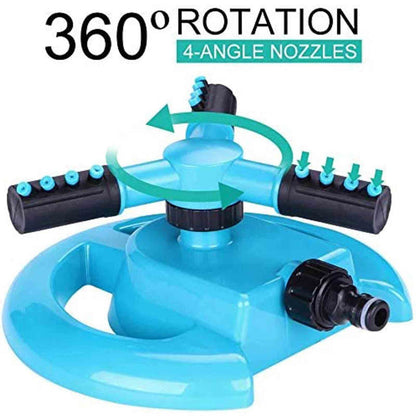 Parents watching kids enjoy a rotating water sprinkler, perfect for backyard summer fun.