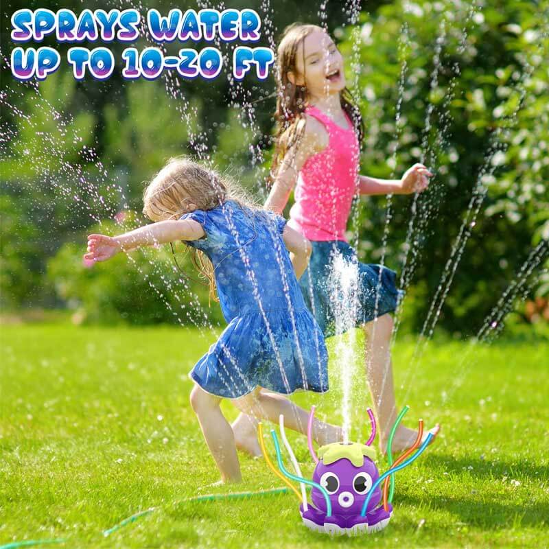Group of kids laughing and running through jets from an octopus sprinkler toy.