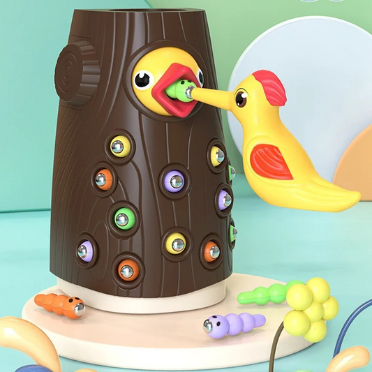 Kids playing with magnetic bird feeding toy, developing fine motor skills and hand-eye coordination