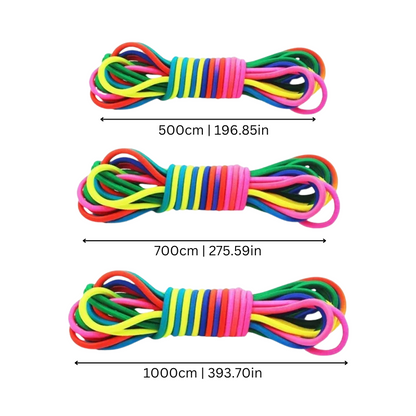 Group of children enjoying an outdoor game with a colorful stretchy rainbow play rope