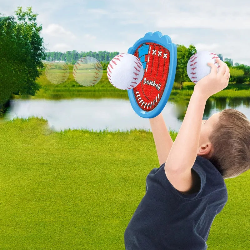Kids playing with sticky sports ball set, light-up paddles glowing in the dark for reactive play