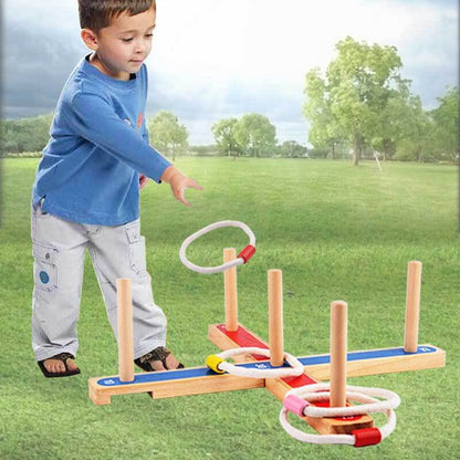 Kids playing wooden outdoor ring toss quoits game, perfect for family fun & active play
