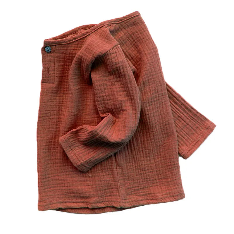 Cute baby wearing a gentle pink pleated linen & cotton blend t-shirt, baby clothing essential