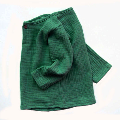 Close-up of pleated detail on a long-sleeved kids' linen cotton blend t-shirt, breathable fabric