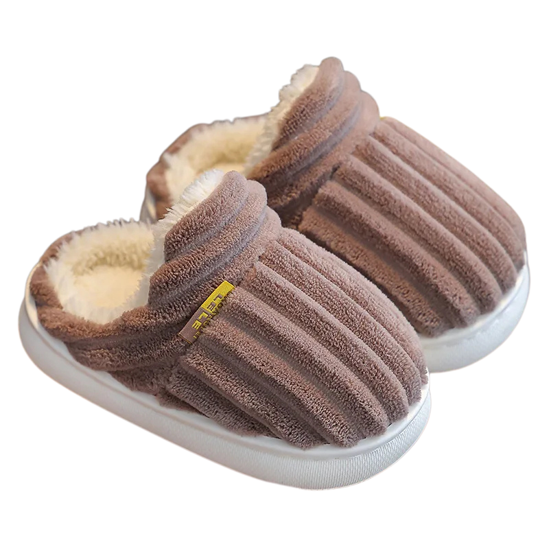 Plush anti-slip indoor shoes for kids, ensuring warm feet and safety on winter floors.