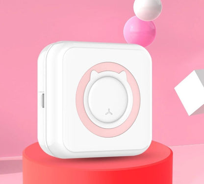 Child holding a vibrant instant photo printer, ready to print fun memories, a portable gadget.