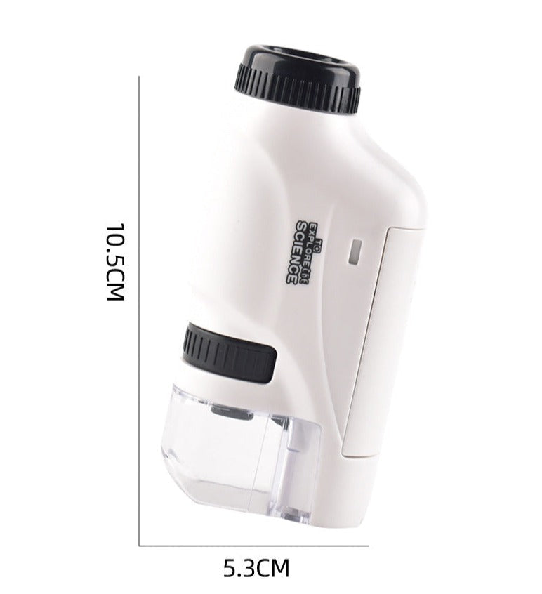 Child peeking into a compact LED pocket microscope, engaging in scientific observation and learning