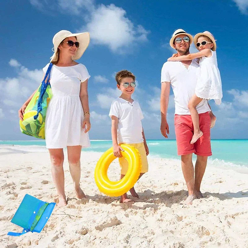 Foldable mesh beach bag for kids' toys, quick dry, shown empty on sand