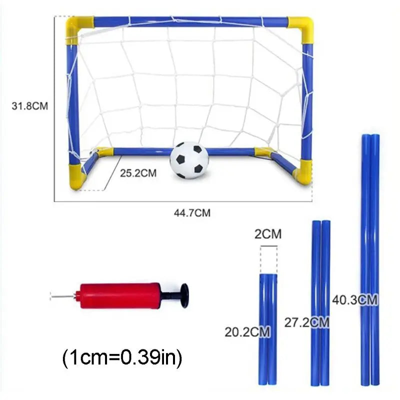 Toddler playing soccer with a mini portable goal, green backyard, active sports toy