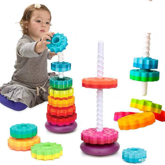 Kids' rainbow spinning tower toy with colorful rings, perfect for toddler fine motor skill development.