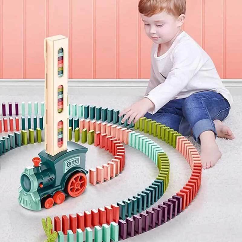 Educational kids' toy: automatic red domino train with a stack of colorful dominoes ready to be laid.