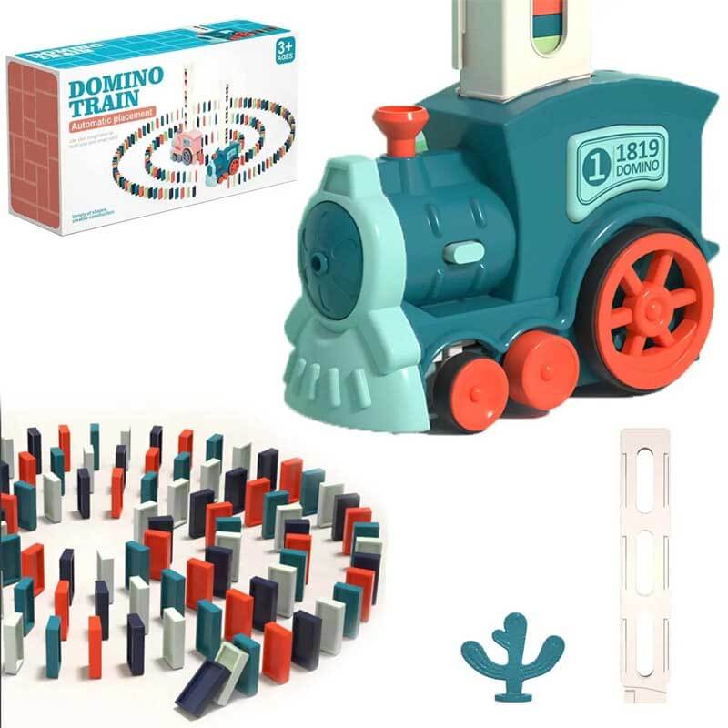 A child's hands interacting with a red automatic domino train, setting up a chain reaction game.