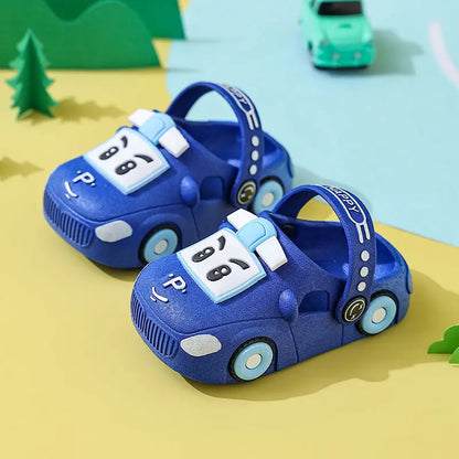 Close-up of a yellow cartoon car sandal, showing detailed car design and breathable material