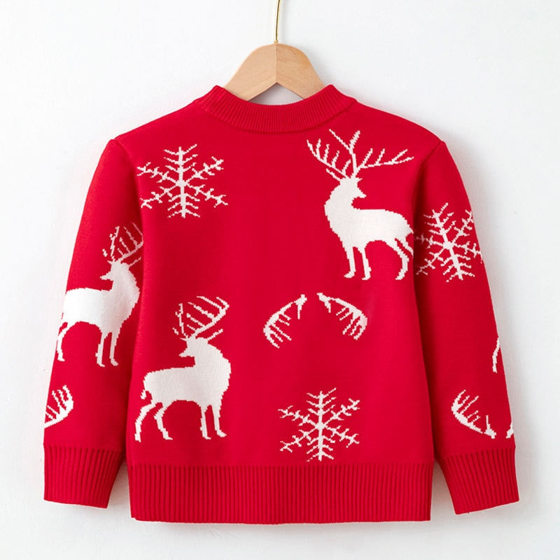 Orange kids' Christmas sweater with a cute gingerbread house, perfect holiday outfit
