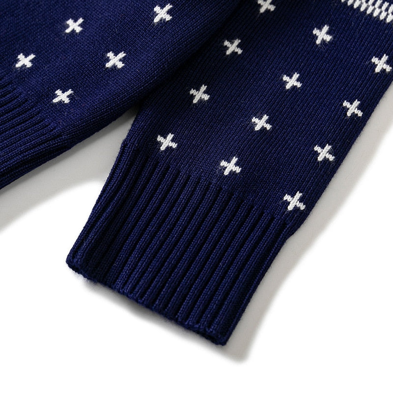 Blue festive knit Christmas sweater for kids with a 'Merry Christmas' message, winter