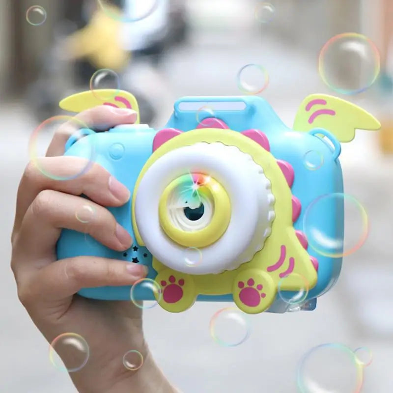Kids' red musical bubble camera toy with pink strap, perfect for outdoor playtime & summer fun.