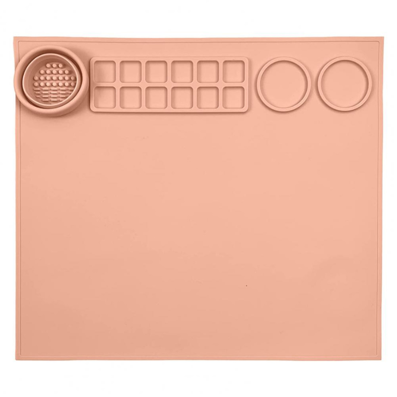 Green silicone art mat for kids' crafts, showing paint palette sections for organized, mess-free artistic expression.