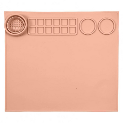Green silicone art mat for kids' crafts, showing paint palette sections for organized, mess-free artistic expression.