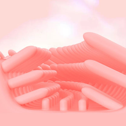 Close-up of a pink silicone brush head on a kids' sonic electric toothbrush for gentle gum care.