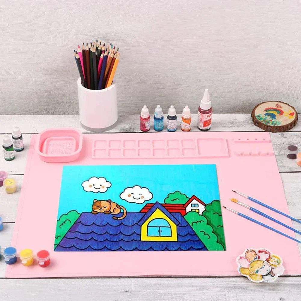 Kids' reusable silicone painting mat with spill guard, perfect for creative play & easy clean art