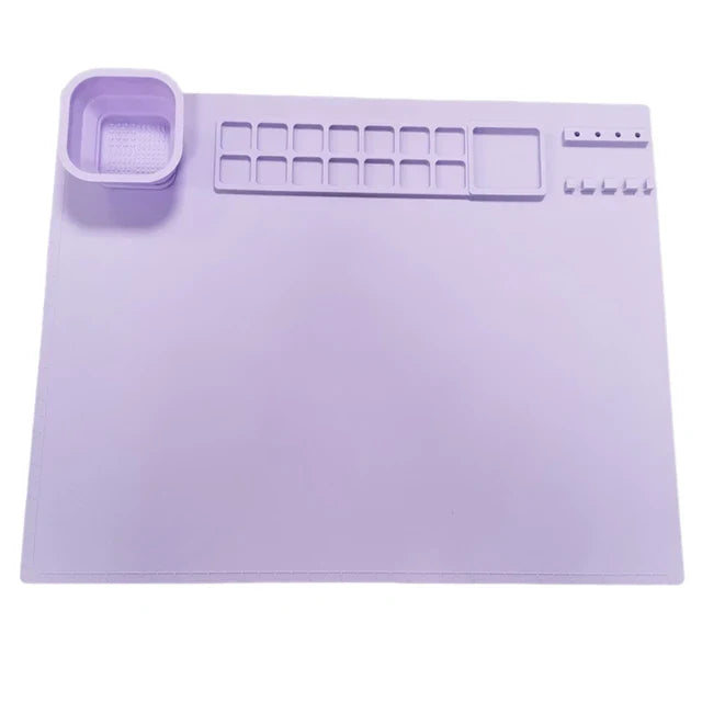 Mess-free silicone painting mat with spill guard, essential art accessory for young creative minds