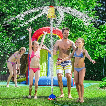 Happy child getting wet from a rocket water sprinkler, ideal for summer backyard fun.