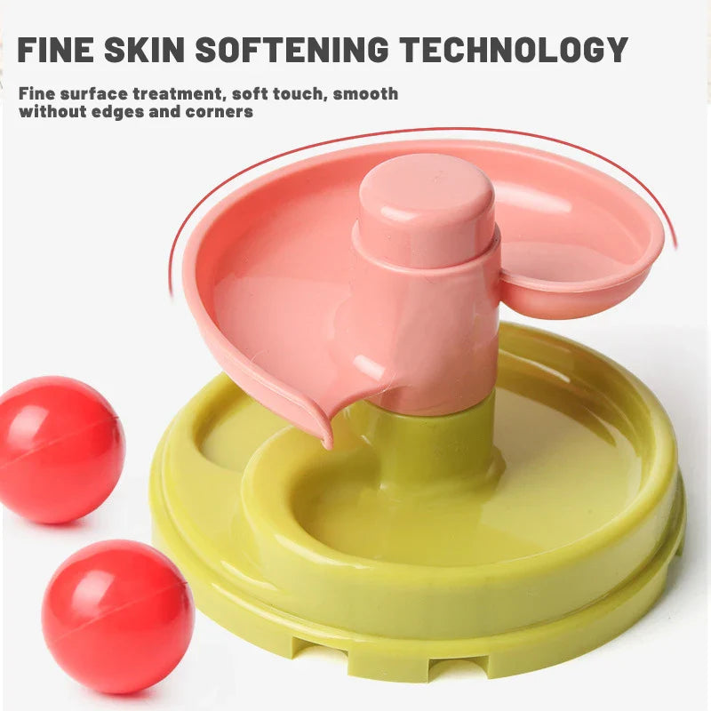 Developmental kids activity: a child drops balls down a rotating sensory stacking toy