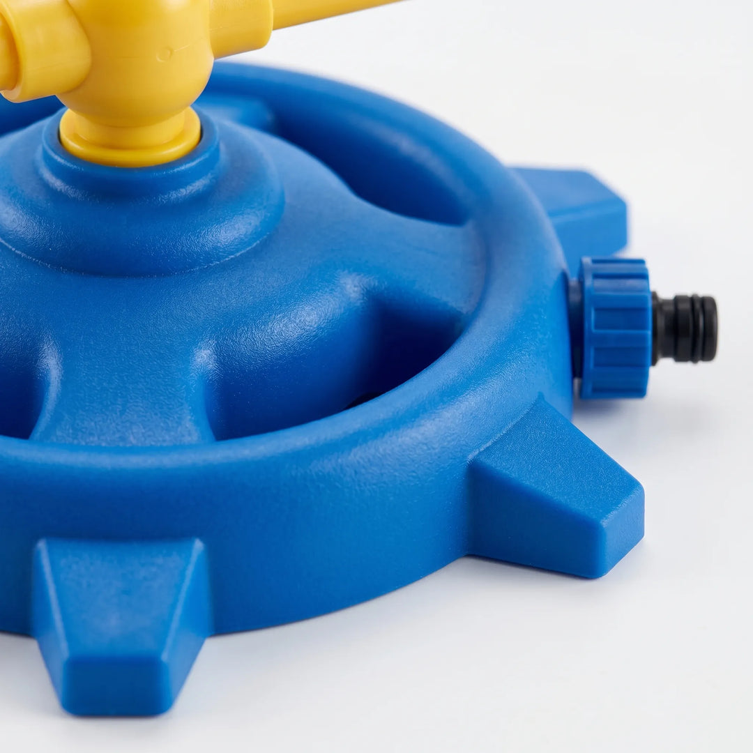 Active kids enjoying a rotating water sprinkler, ideal for cooling down during hot summer outdoor play and backyard parties.