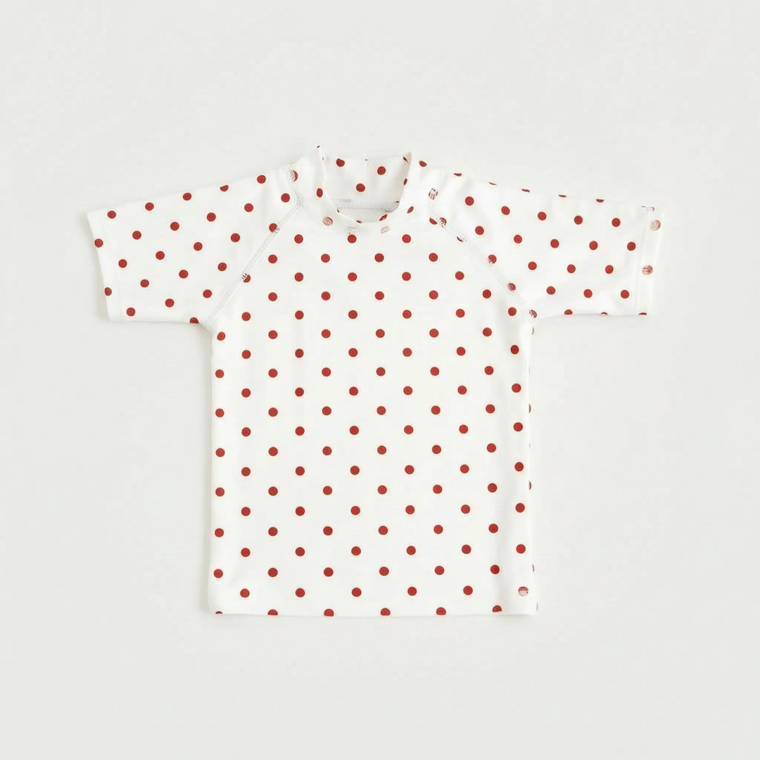 Kids' short-sleeve rash guard, designed for sun safety. Ideal swim top for beach holidays & pool activities.