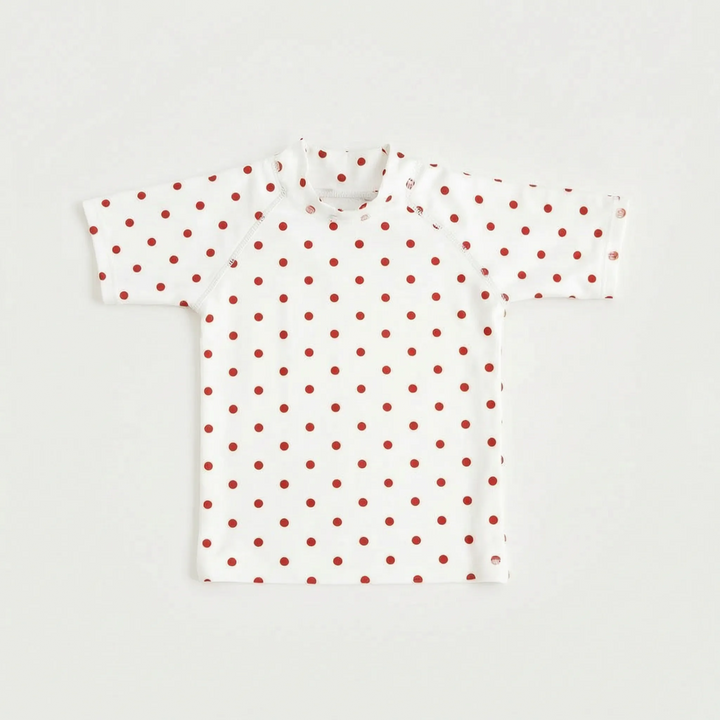 Kids' short-sleeve rash guard, designed for sun safety. Ideal swim top for beach holidays & pool activities.