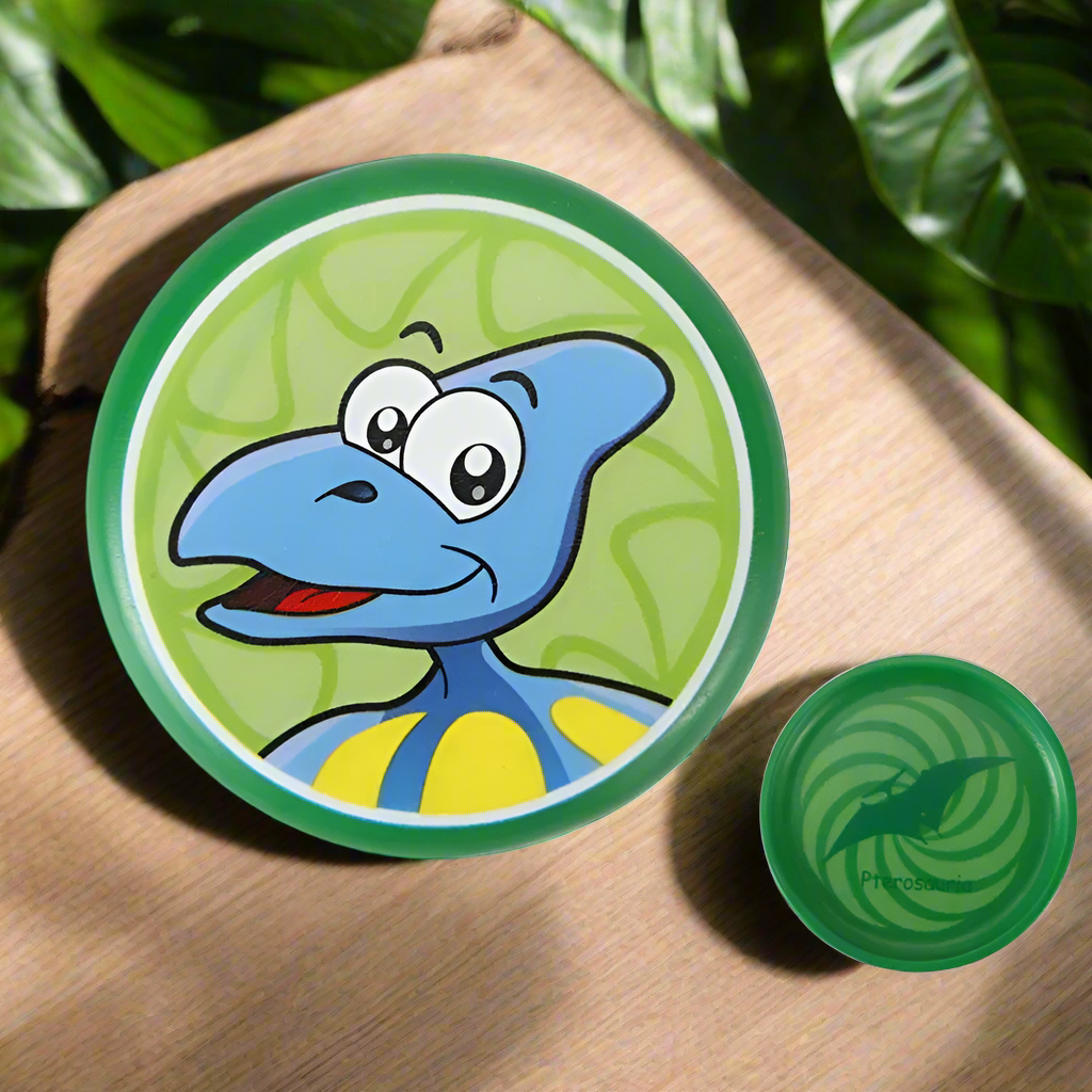 Packaging showing a kids' soft foam dinosaur frisbee, highlighting its safety and outdoor fun