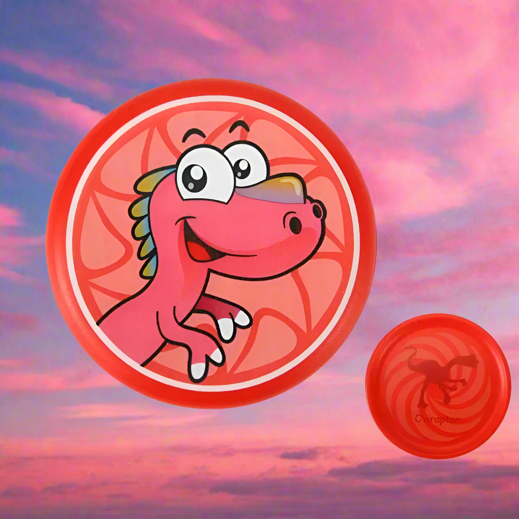 Close-up of a green foam frisbee for kids with vivid dinosaur illustration, children's outdoor toy