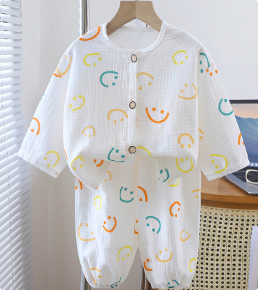 Happy toddler in soft organic cotton linen sleepwear, enjoying a good night's rest