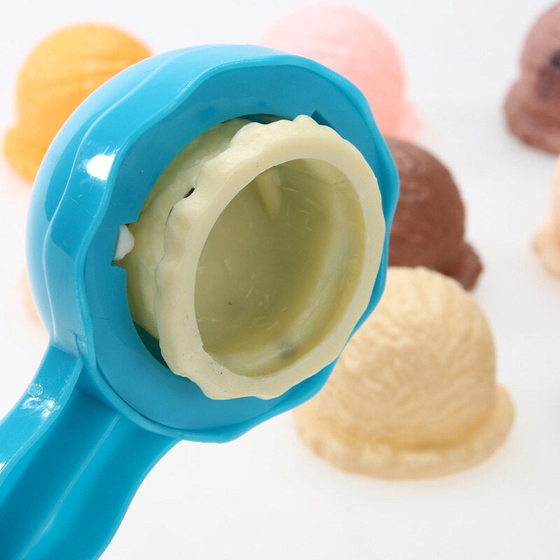 Toy kitchen scene with a completed, wobbly Kids' Creative Ice Cream Tower, engaging childrens activity.