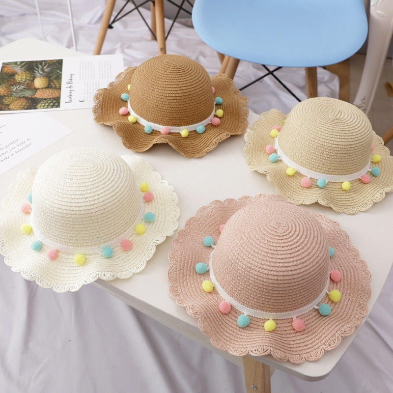 Newborn to young child straw hat and bag set, designed for comfort and summer style.