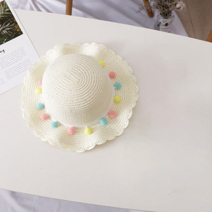 Adorable children's straw hat and bag combo, ideal for little ones' summer fashion and outdoor play.