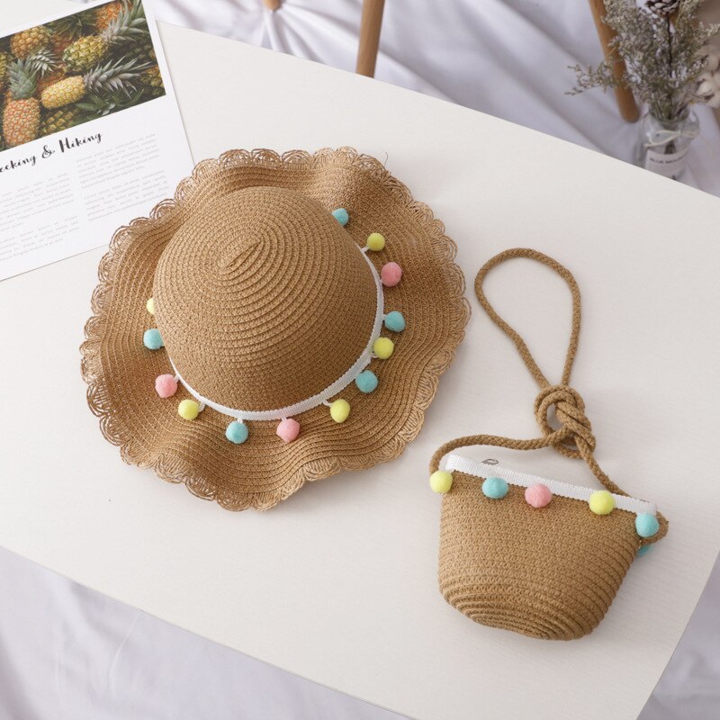 Kids' beach wear: natural straw sun hat and handbag set, providing UV protection for young adventurers.