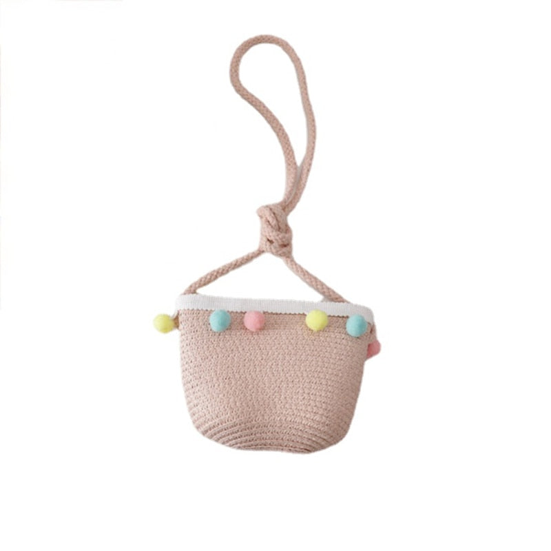 Eco-friendly straw hat and bag set for kids, handmade for durability during summer activities.