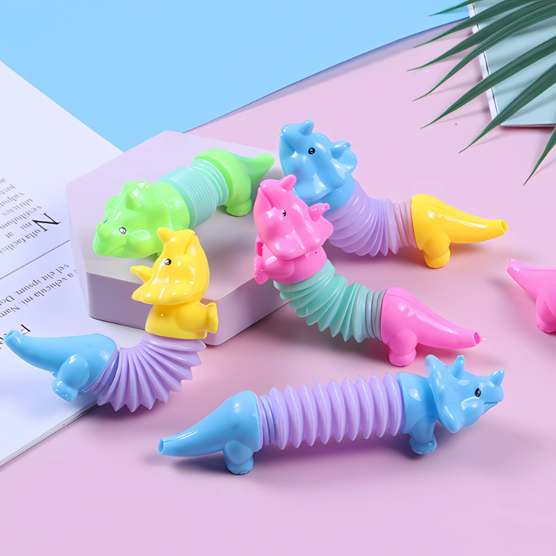 Kids stretchy dinosaur toy set for fun stress relief & creative play, featuring a green T-Rex and blue Triceratops.
