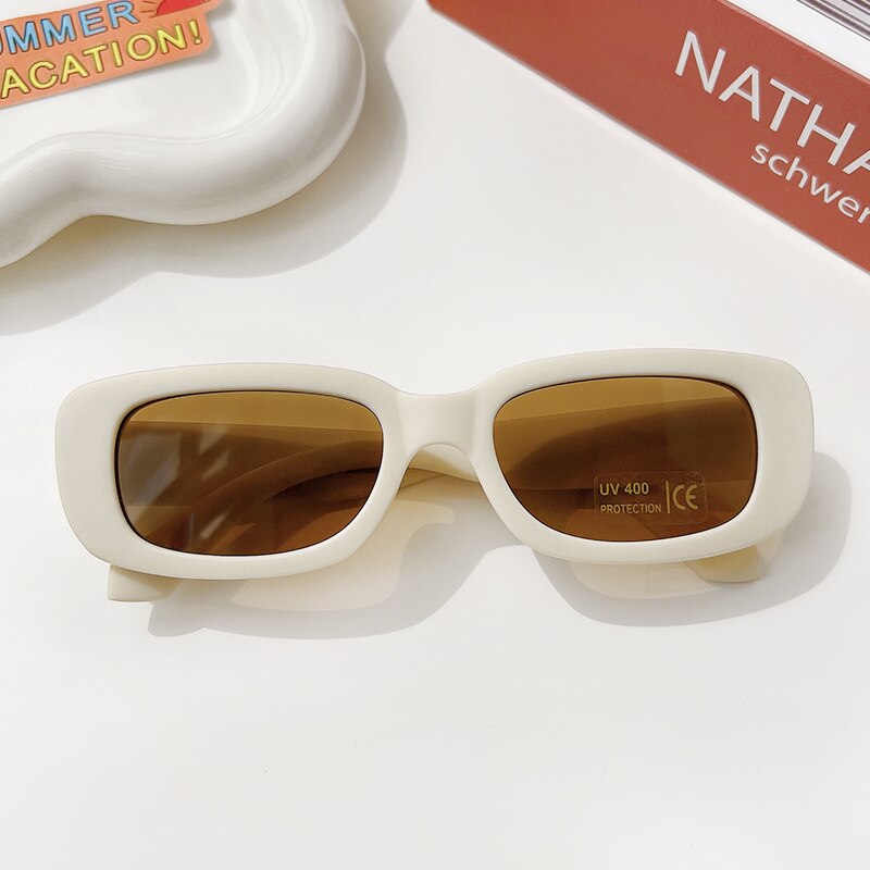 Rectangle sunglasses for children, providing superior UV protection in a variety of vibrant colors.