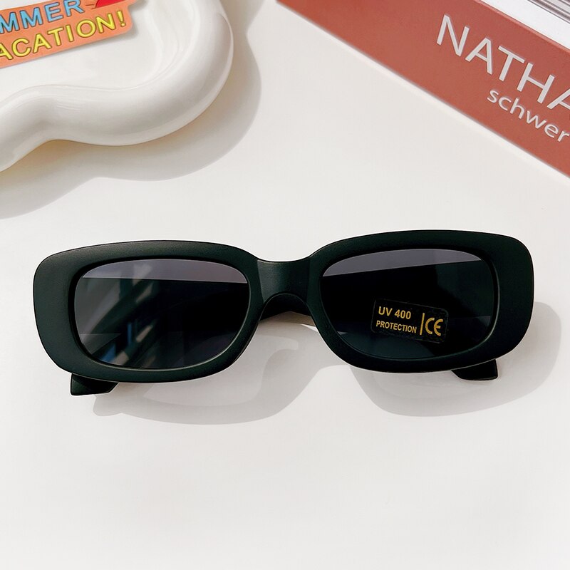 Baby accessories: cool rectangle sunglasses with UV protection, perfect for beach trips and sunny outings.