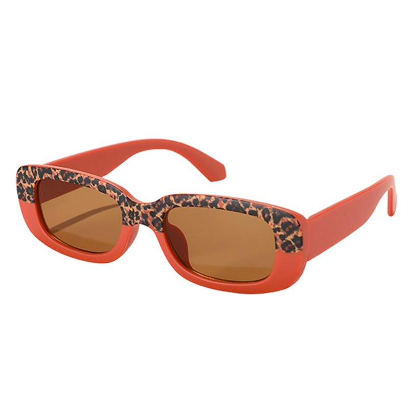 Toddler wearing stylish rectangle sunglasses, showcasing UV protection and a fun, modern design.