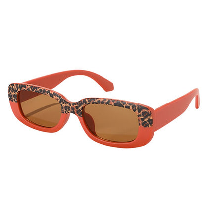 Toddler wearing stylish rectangle sunglasses, showcasing UV protection and a fun, modern design.