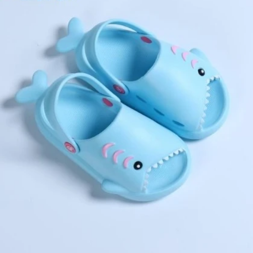 Pair of children's shark design beach slippers, perfect for summer play and water activities.