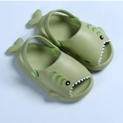 Blue shark-themed play shoes for children, featuring a comfortable and water-friendly design.