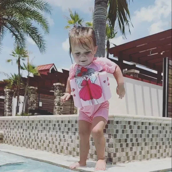 Kids' swim float vest with UV sun protection, built-in shorts for safe pool fun.