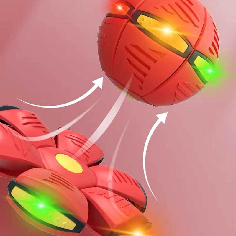 Children playing outdoors with a red transforming UFO disc ball toy, perfect for active fun