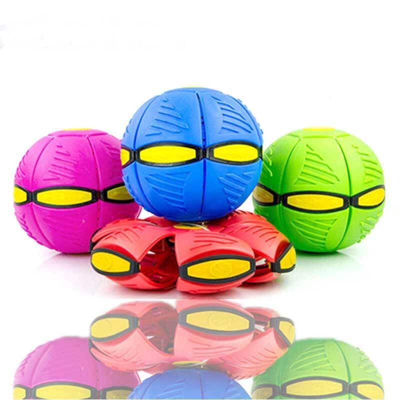 Hand holding a purple transforming UFO disc ball toy, illustrating its size for kids